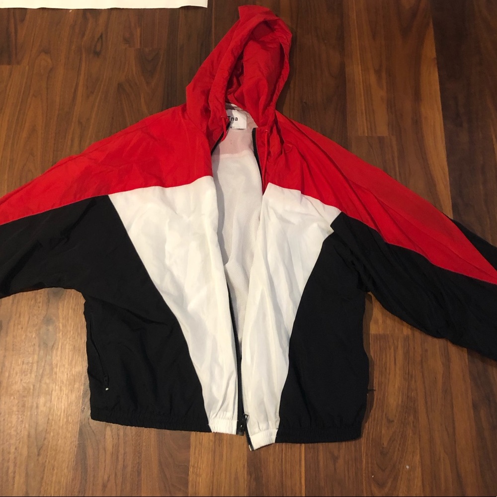 black, white, and red aritzia tna windbreaker